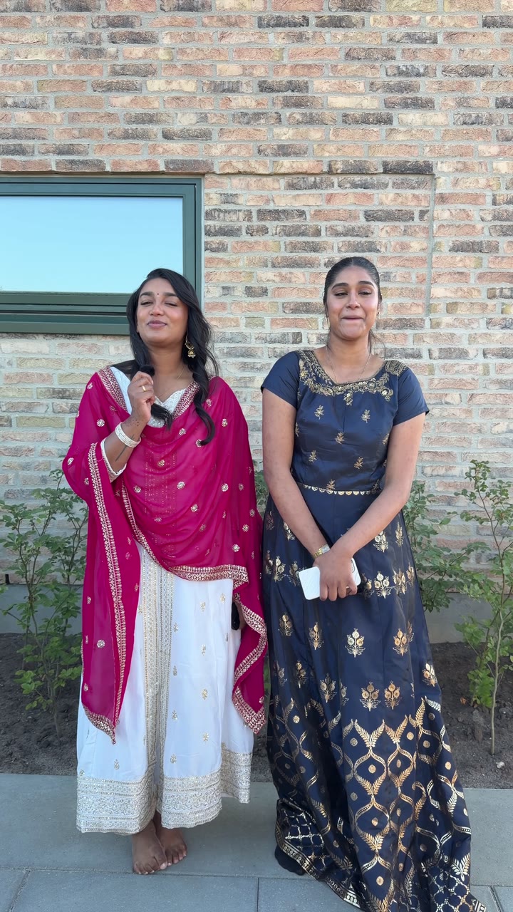 Two women sharing a personal message outside, from the Memoria interview example.
